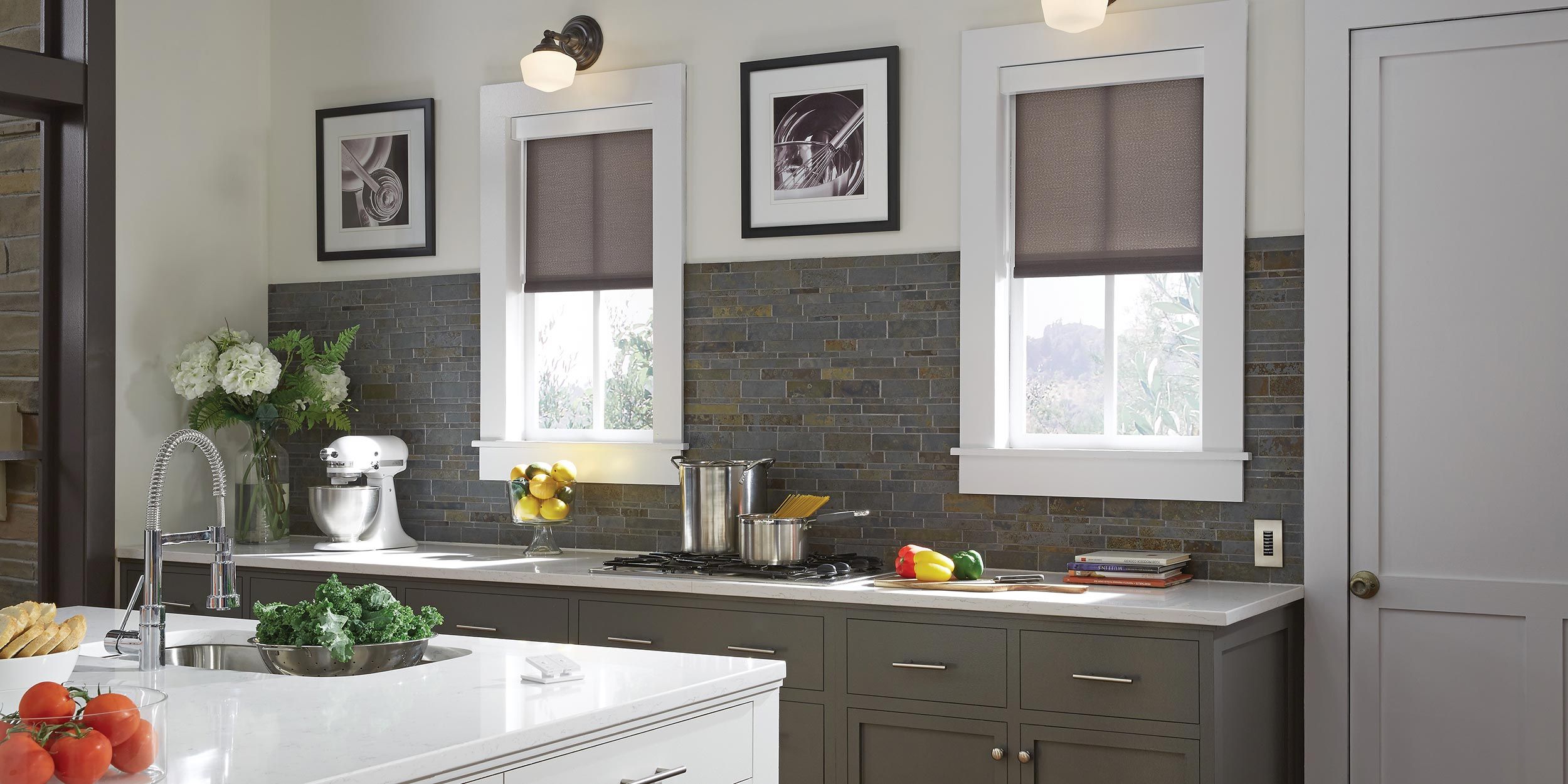 A cozy kitchen with natural light, window shades, and a tiled backsplash.